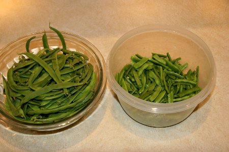 Fresh green beans being prepped for freezing