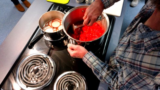 Stirring cooked strawberries