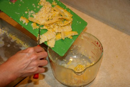 Transferring kernels into glass measuring container 2 photo