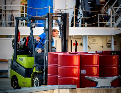 Chief Boatswain Jerrod Hozendorf loads some final stores before getting underway