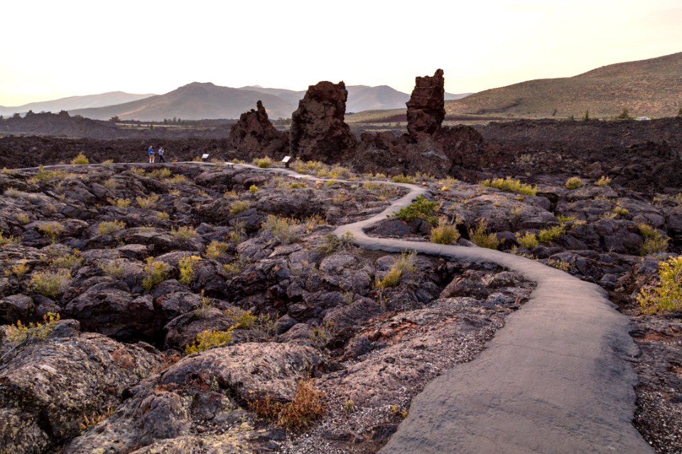 Hikers on North Crater Flow Trail at sunset