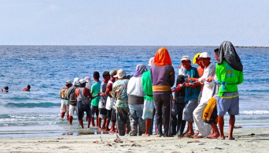 Team work. Hauling in nets.Philippines.