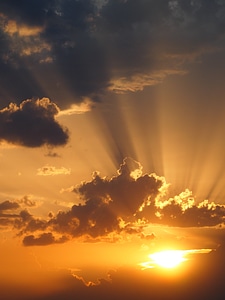 Sunset clouds rays photo