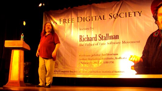 Richard Stallman on stage, about to begin his speech photo
