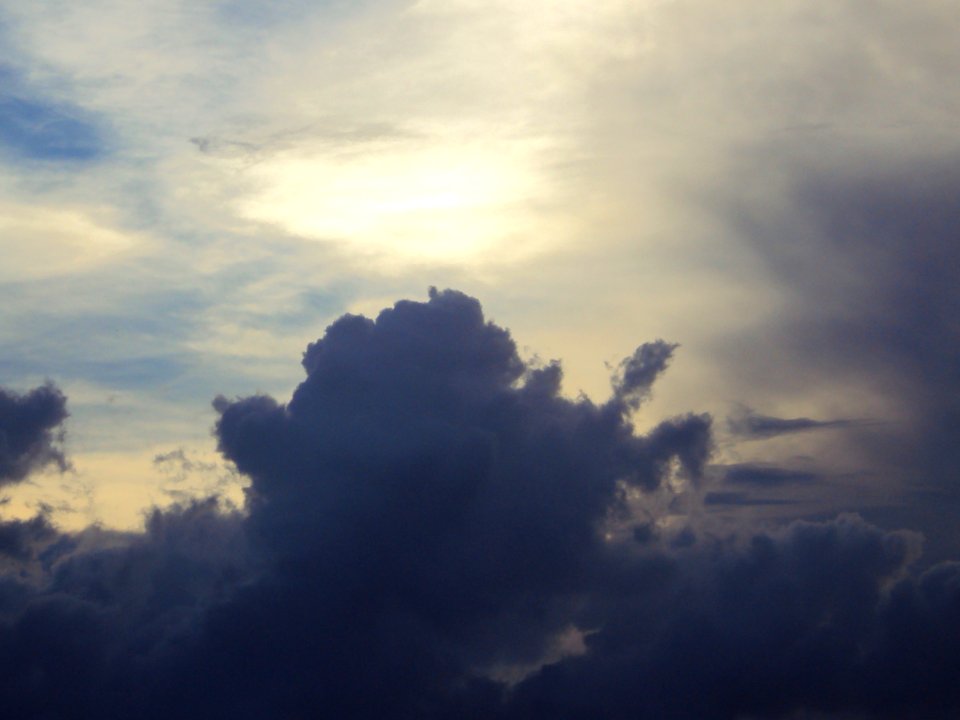 A plume forms in the darkening sky