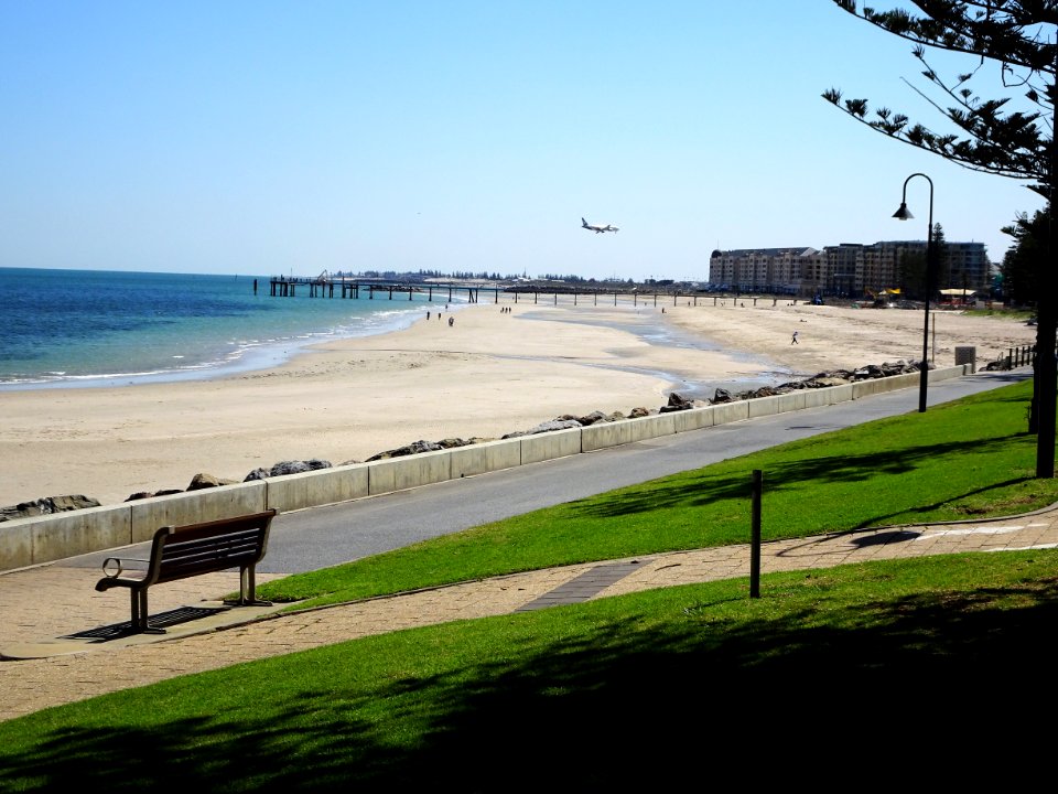 Glenelg. The Air New Zealand daily flight from Auckland to Adelaide coming in to land at Adelaide International AIrport just beyond Glenelg beach.