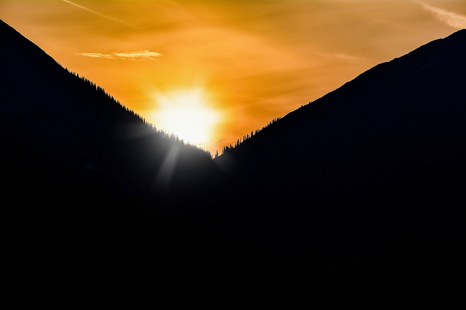 Sun lighting mountains
