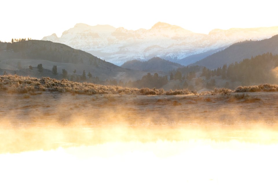 Steam from ephemeral ponds lit up at sunrise