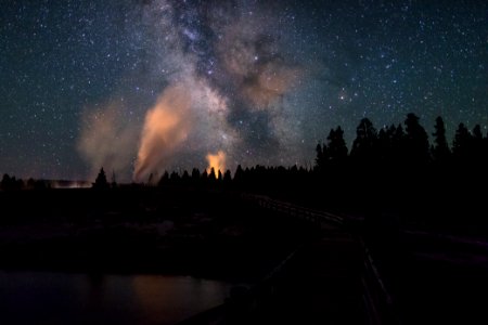 Milky Way and Castle Geyser viewed from the boardwalk over the Firehole River