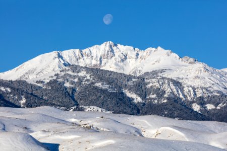 The moon above Electric peak after a winter storm (2) photo