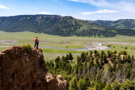 Hiker overlooking Lamar Valley on a summer afternoon photo