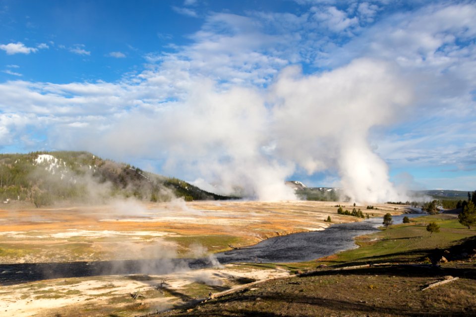 Grand Prismatic Spring and Excelsior Geyser Crater steaming on a spring morning