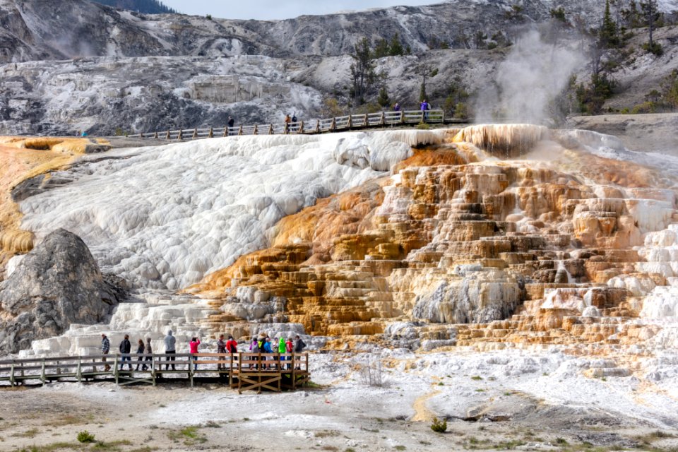 People explore the boardwalks near Palette Spring