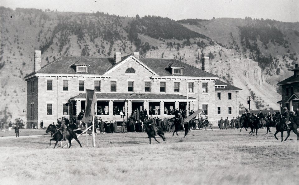 Soldiers drilling in front of Bachelor Officers' Quarters