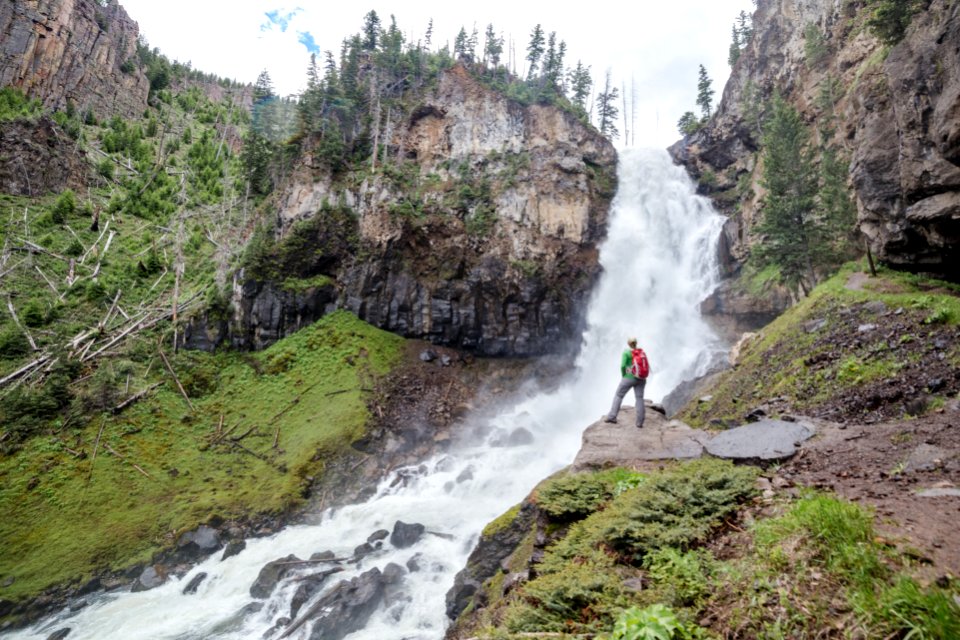 Hiker taking in the view of Osprey Falls