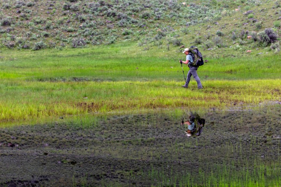 Wet trail conditions for a backcountry camper hiking near Hellroaring Creek