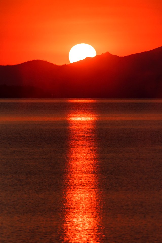 Hazy sunrise from West Thum Geyser Basin (portrait)