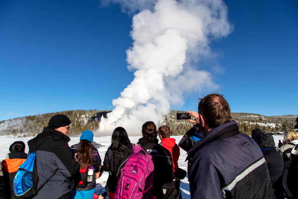 Group watches an Old Faithful Eruption