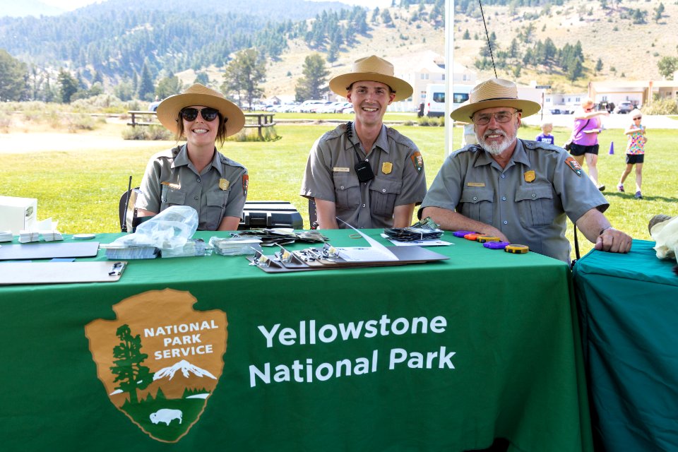 Rangers Madison, Jeff, and Fred staffing the "Wildlife Olympics" desk in Mamomth Hot Springs