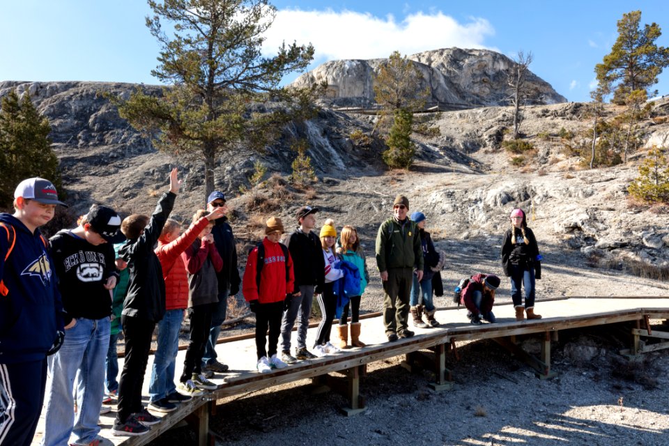 Ranger Mike talks to a school group about Mammoth Hot Springs
