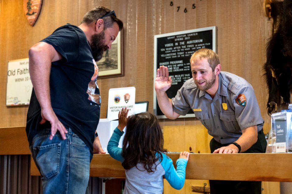 Ranger Jon swears in a Junior Ranger at Grant Village Visitor Center