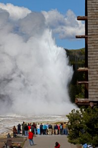 Visitors watching Old Faithful Geyser