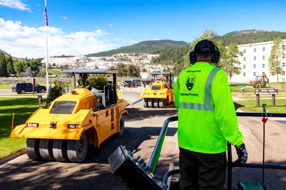 Pneumatic tire rollers pressing the gravel into the asphalt