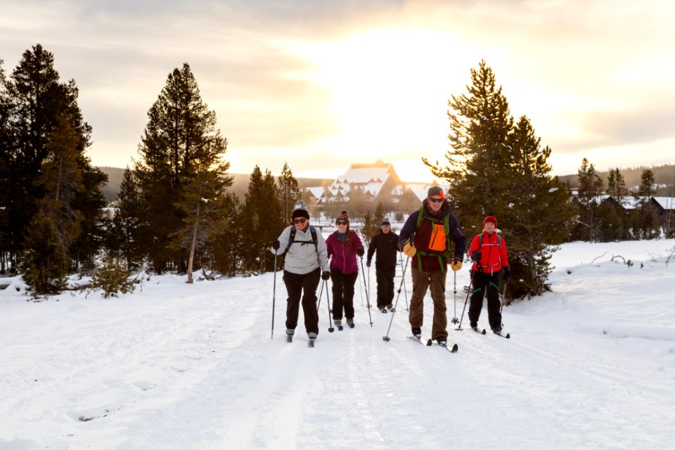 Skiers head out to Castle Geyser at sunrise