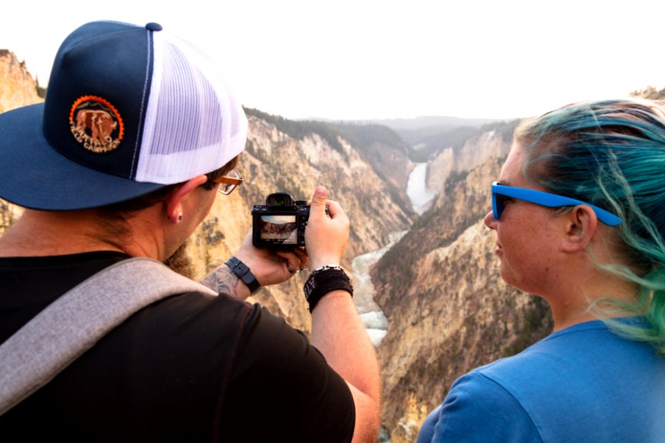 Taking a photo of Lower Falls from Artist Point