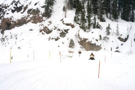 Snowmobiler on the East Entrance Road photo