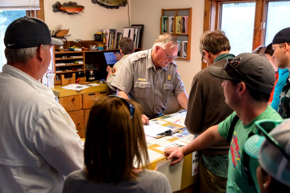 Ranger Roy writing backcountry permits