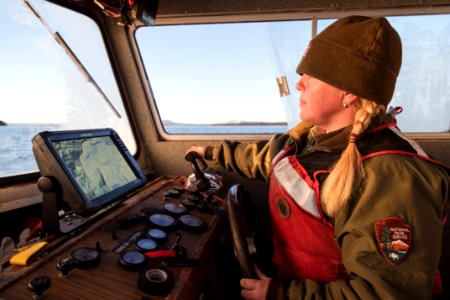 Fish crew member on Yellowstone Lake at sunrise