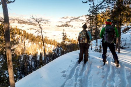 Skiers overlook Tower Junction from Lost Lake Trail
