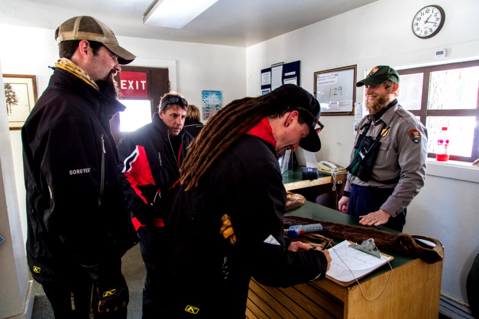 Ranger Jon and snowmobilers at West Thumb Warming Hut
