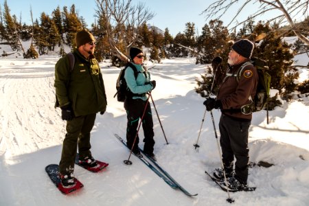 Rangers Michael and Fred talk with a skier on the Upper Terrace Loop Drive