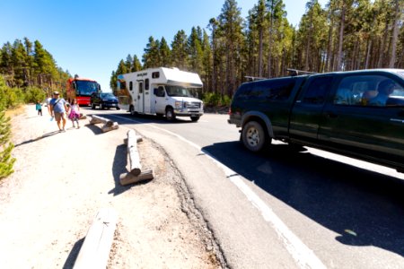 The line to wait for a parking spot at Midway Geyser Basin backs out into the flow of traffic (2) photo