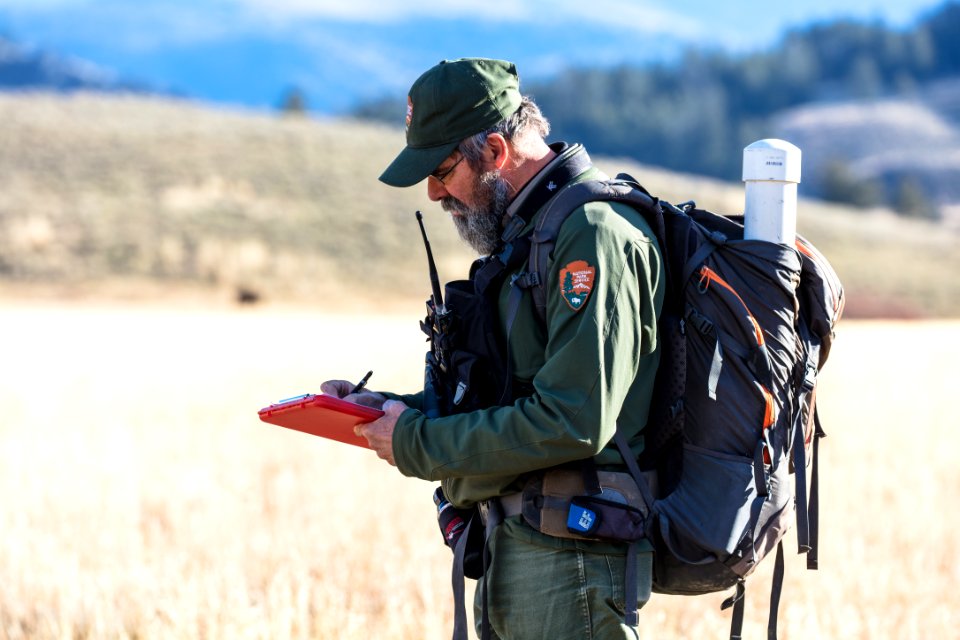 Rick Wallen recording statistics in the field