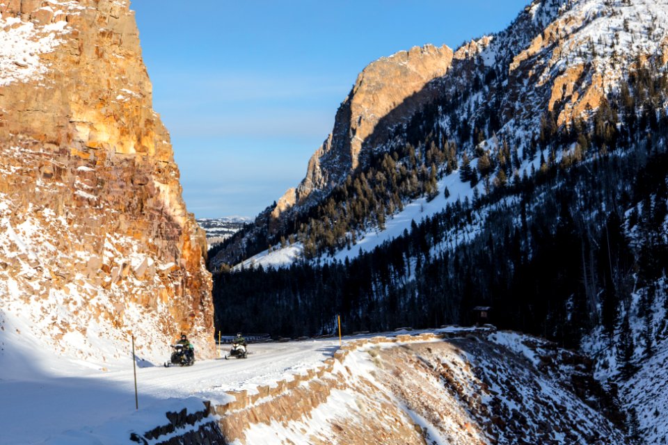 Snowmobilers riding through Golden Gate