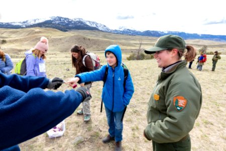 Expedition Yellowstone group playing "Rock in Fist," a game from the Little Shell Band of Landless Chippewa