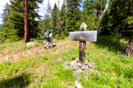 Backpacker at trail junction near Horse Creek photo