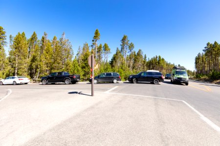 The line to wait for a parking spot at Midway Geyser Basin backs out into the flow of traffic photo