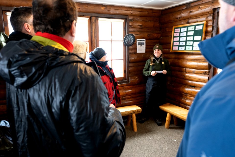 Ranger Addy visits with people in the Fishing Brdge Warming Hut