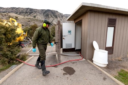 Prepping the vault toilet for pumping photo