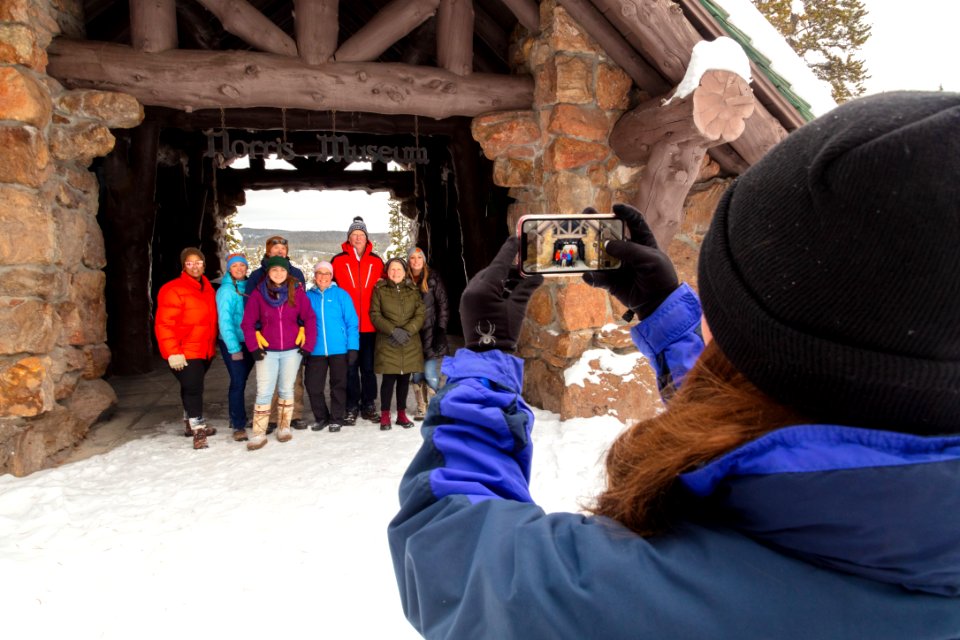 Guide takes a group photo at Norris Musem in winter