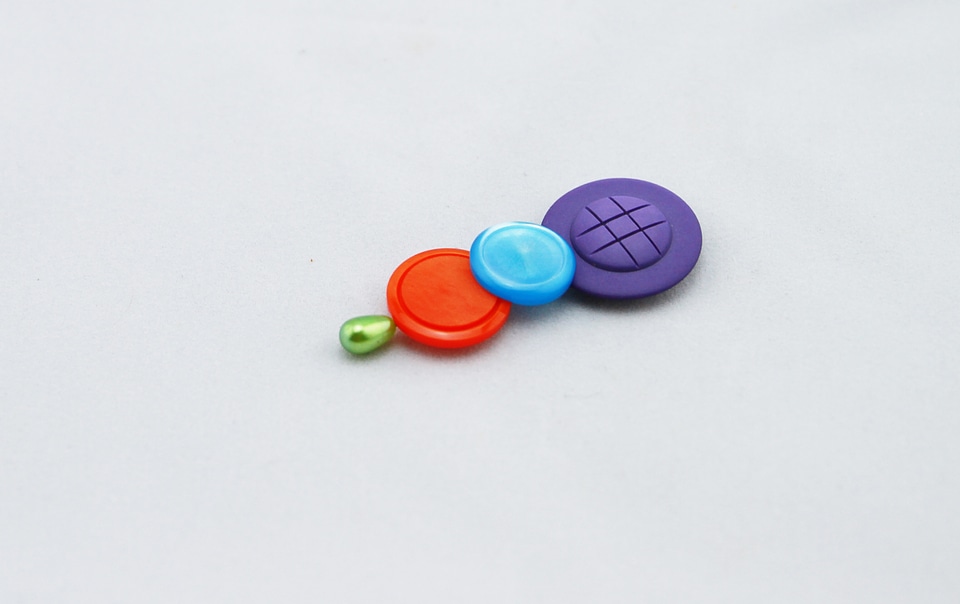 Purple button blue button orange button