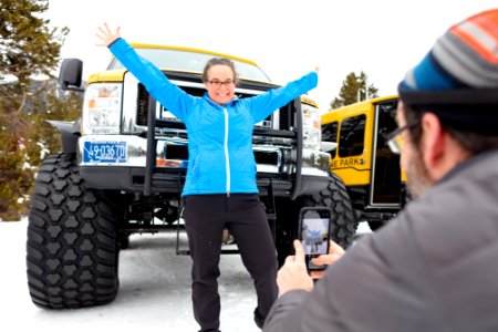 Posing with a snowcoach photo