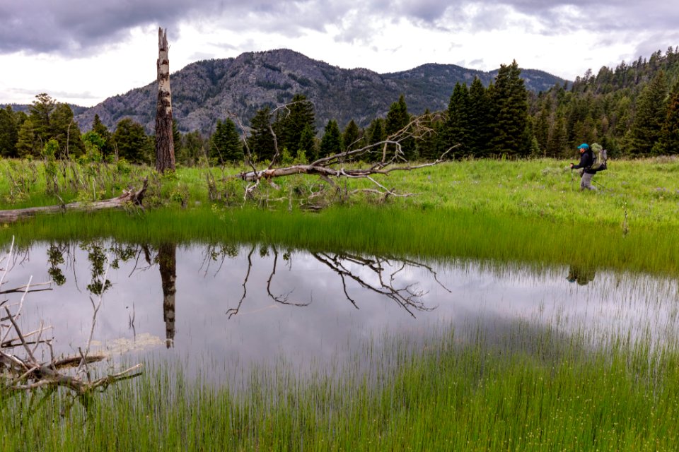 Backpacker near a pond along the Coyote Creek Trail near the boundary