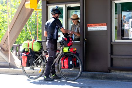Ranger welcomes bicyclist at East Entrance (2)