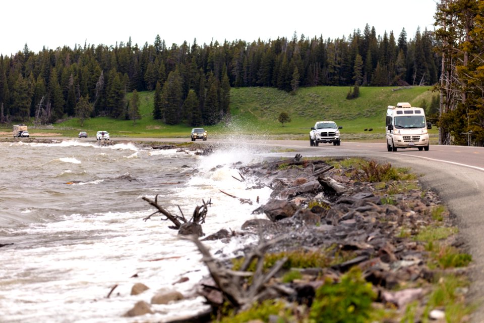 Waves crashing over the road near Mary Bay