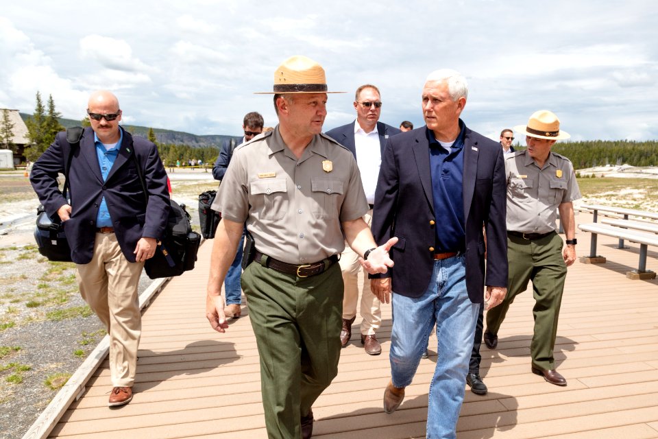 Superintendent Cam Sholly walks with Vice President Mike Pence at Old Faithful